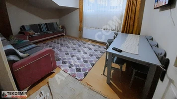 2+1 apartment on the ground floor with a garden, suitable for mortgage financing, in the MİMARSİNAN area, offered by TEKDEMİR EMLAK.