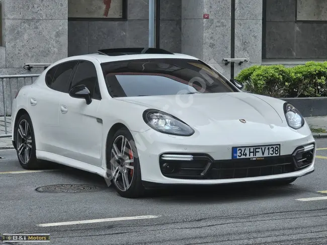 Porsche Panamera 4 with an updated front fascia, new type of headlights, and bumper from Bi Motors