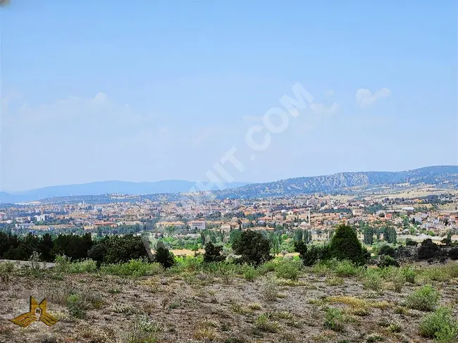 A plot of land on the road with an area of 13,800 square meters, one kilometer away from the center of Gediz, Kütahya