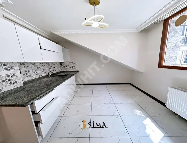 2+1 apartment close to the square on the ground floor by Sima Yapi Real Estate