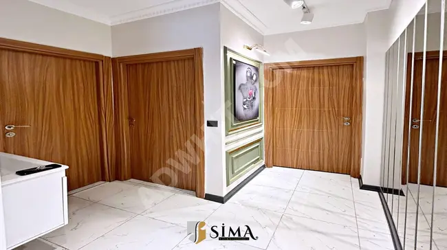 2+1 apartment close to the square on the ground floor by Sima Yapi Real Estate