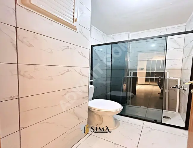 2+1 apartment close to the square on the ground floor by Sima Yapi Real Estate