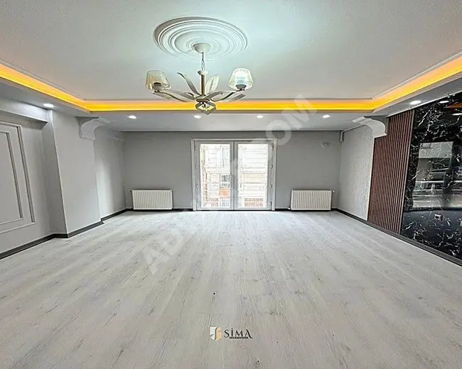 For sale, a luxury apartment of 120 square meters, consisting of two rooms and a living room, with a double facade in Esenyurt