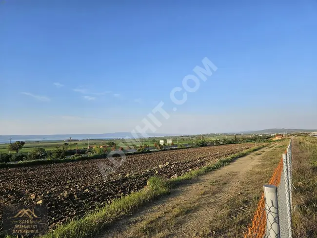 Land for sale with an area of 2,200 square meters in a prime location between two highways and a sea view