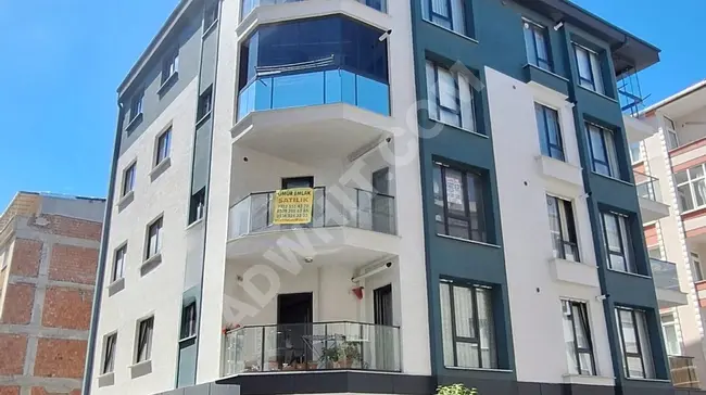 A new 2+1 apartment, 100m², corner location on Mahmoud Bey Street next to Diva Restaurant