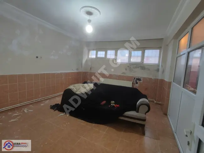 A commercial property for rent with an area of 100 square meters in the Fevziçakmak neighborhood, featuring a bathroom, kitchen, and heating