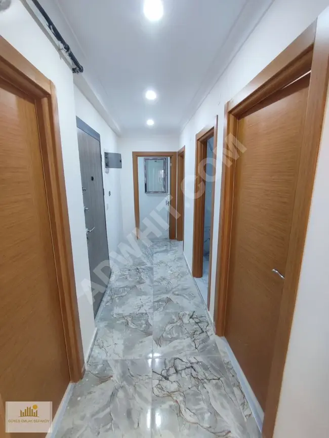 Apartment for sale in the center of SEFAKÖY, a new apartment with three rooms and a living room, 120 square meters with a balcony on the middle floor