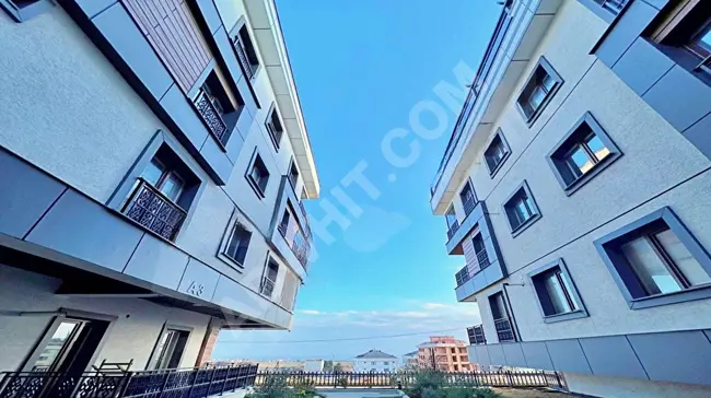 2+1 apartment with a sea view in a complex close to the beach from VİENN'!