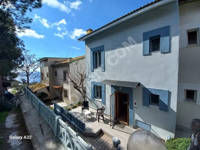 Villa for sale 3+1 in a residential complex with a swimming pool and a full sea view in Doğanbey