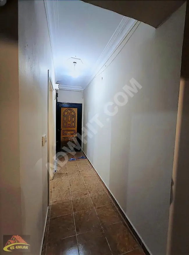 2+1 apartment for sale on the ground floor with a garden in İKİTELLİ, ATATÜRK neighborhood