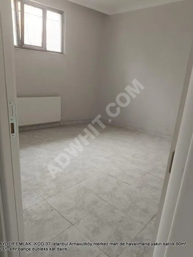 A duplex apartment with a garden, 90 square meters in size, containing two rooms and a living room (2+1) for sale in the center district of Arnavutköy near the airport