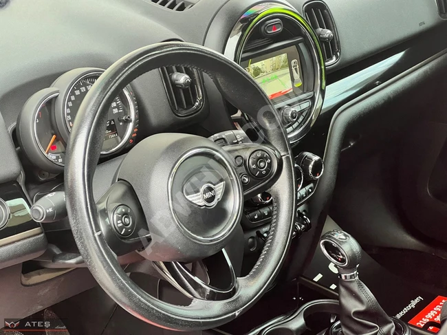 Mini Cooper Countryman ALL4 with a panoramic roof, electric tailgate, heating, and rearview suitable for financing