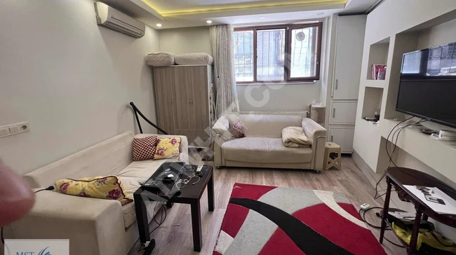 1+1 apartment for sale in Halicoglu neighborhood, on Ciksallen Street in Beyoglu by MST EMLAK