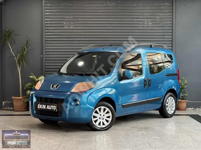 2011 Peugeot Bipper, a blue car equipped with a rearview camera, steel rims, Bluetooth, double sliding door, and extra comfort