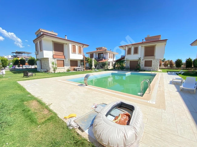 3+1 villa for sale in Dogan Bey within a residential complex with a very luxurious pool