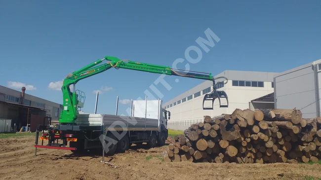 Timber loader, timber grab. A model equipped with a rotator