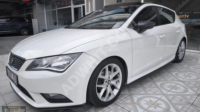 From SARIAY - 2014 Seat Leon with a 1.6 TDI engine and a glass roof, having covered 142,000 km