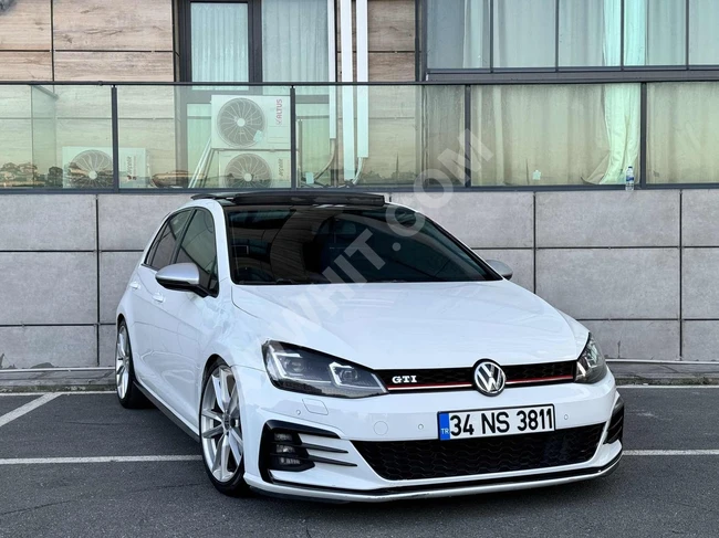 Volkswagen Golf 1.4 TSI Highline with a glass roof, rims, and Coil suspension system