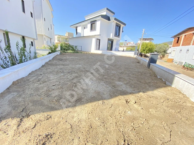 A 2+1 villa for sale near the sea with a very large garden in Payamlı