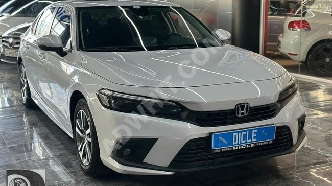 From DİCLE OTO: Honda Civic model 2021 with sunroof, rear camera, heated seats, and loan options