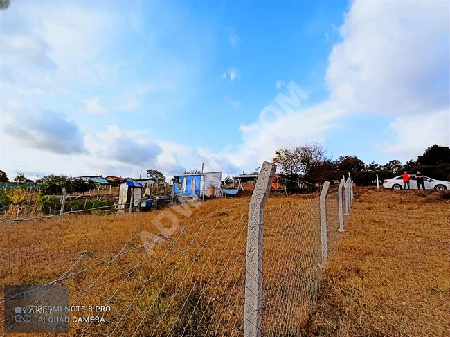 A plot of land measuring 360 m² for sale within the village in the ÇATALCA HİSARBEYLİ district with a building permit