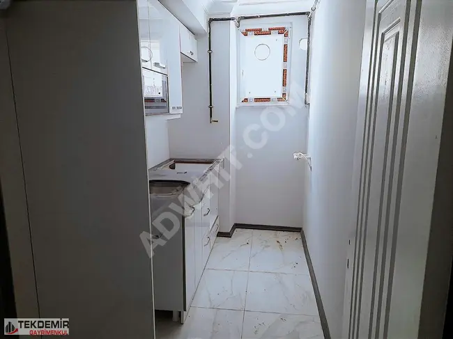 Apartment 2+1 on the ground floor with a garden near the MENDERES metro station, new and suitable for loans from TEKDEMİRD