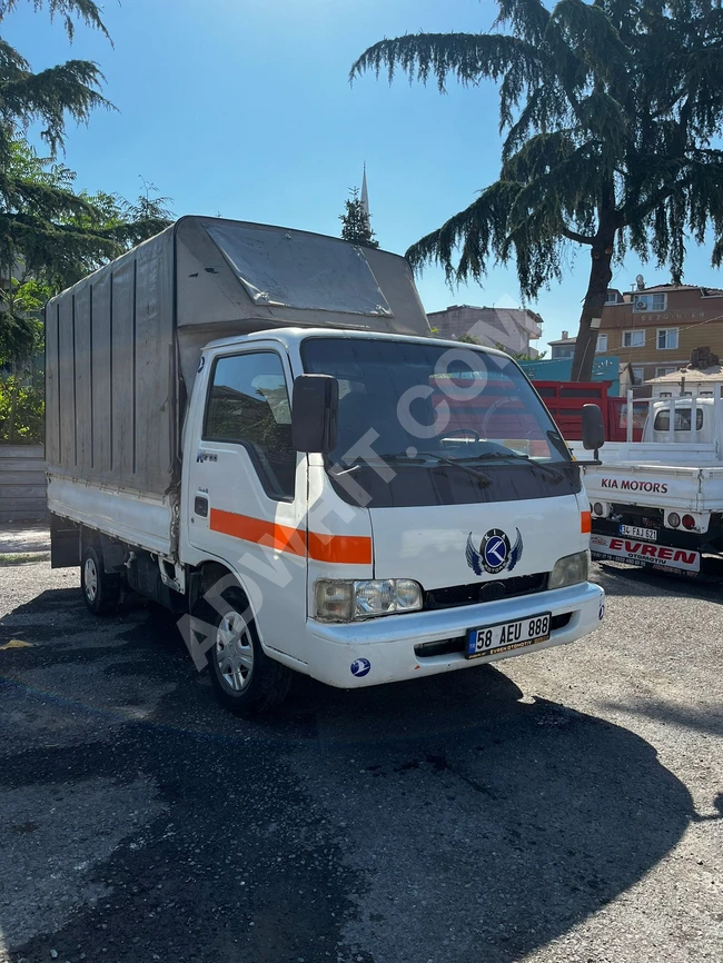 Kia Bongo car model 1998, with two wheels and a convertible roof, in a valid inspection condition