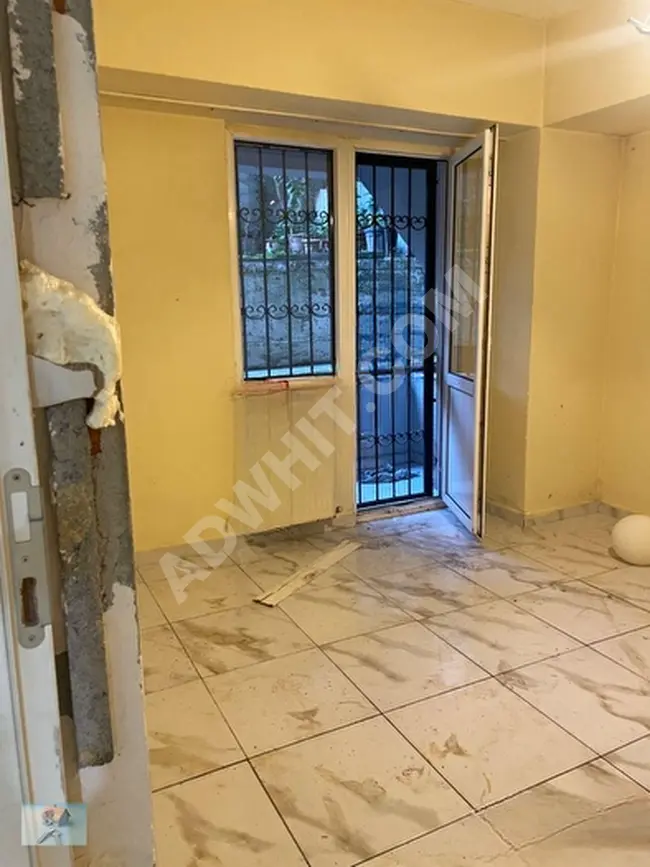 Apartment for sale 2+1 in a spacious building, 80 square meters with central heating, balcony, elevator, and parking - garden floor - from TİAMO