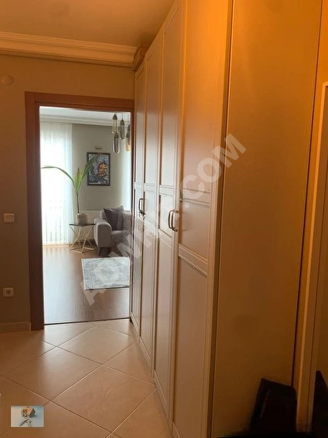 Apartment (2+1) in a modern building, located on the fourth floor, equipped with an elevator and a closed parking space, contains a heating system (Combi) from Tiamo