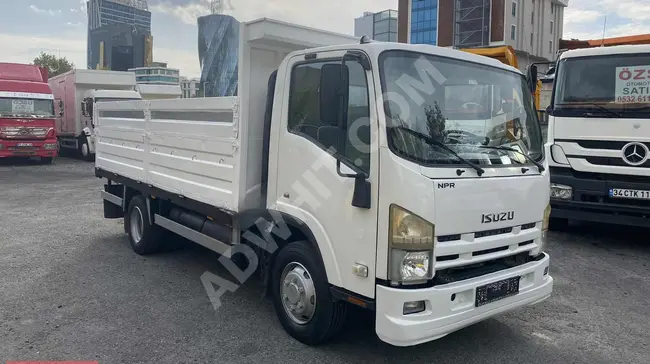 ISUZU NPR 8 truck model 2012 with a metal chassis