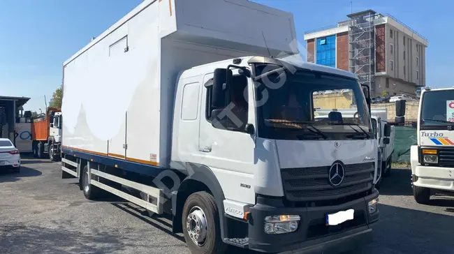 MERCEDEZ ATEGO 1518 truck, model 2021, for home-to-home transport with a multi-purpose container