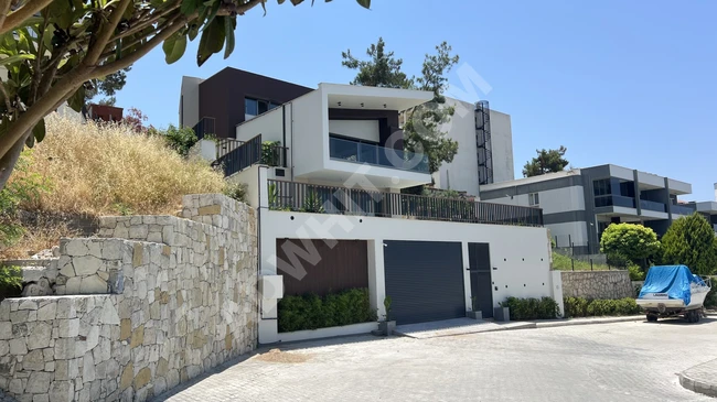 Villa with three luxurious floors for sale with a unique view in Kuşadası