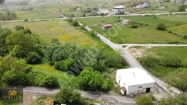 A plot of land measuring 350 m² on the outskirts of the village surrounded by a fence in ÇATALCA BİNKILIÇ