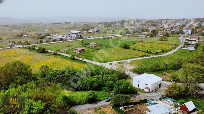 A plot of land measuring 350 m² on the outskirts of the village surrounded by a fence in ÇATALCA BİNKILIÇ