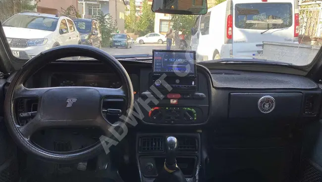 For urgent sale, a DOĞAN SLX IE car equipped with air conditioning, high roof, newly inspected