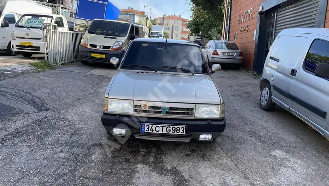 For urgent sale, a DOĞAN SLX IE car equipped with air conditioning, high roof, newly inspected