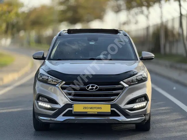 2016 - Hyundai TUCSON - دفع رباعي - حزمة ELİTE PLUS - تنجيد داخلي احمر - مع فاتورة بنسبة   %20