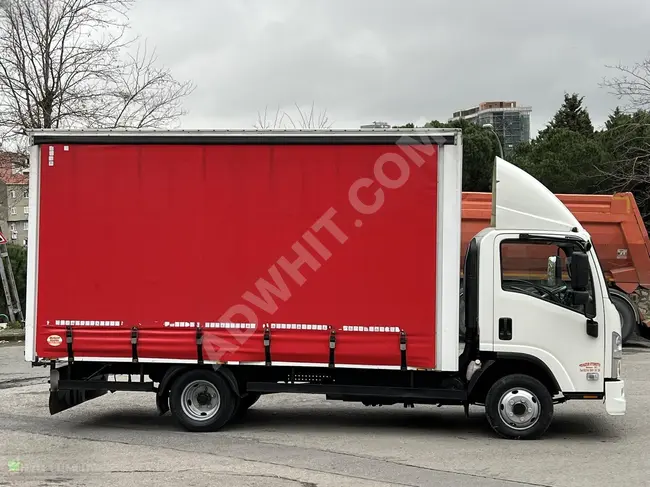 ISUZU N-WIDE LONG truck with a box with large foldable doors, model 2015 from HUZUR OTOMOTİV