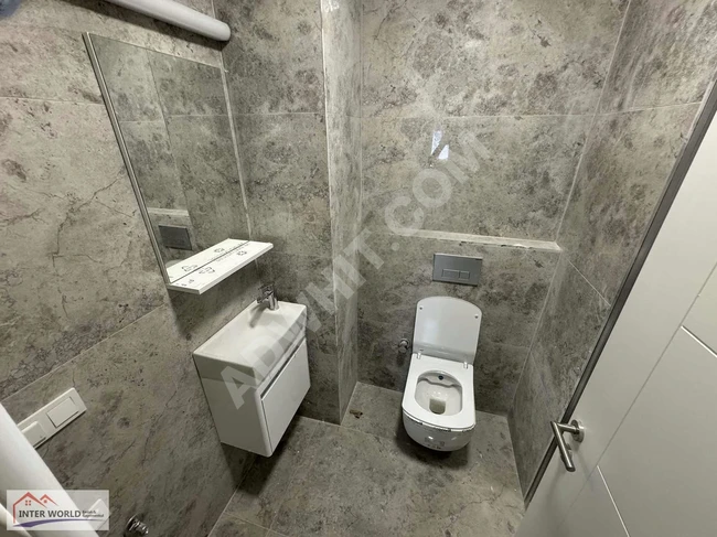 Apartment 5+1 for sale, with private parking, and equipped with built-in kitchen appliances on CENGİZ TOPEL Street by INTER WORLD