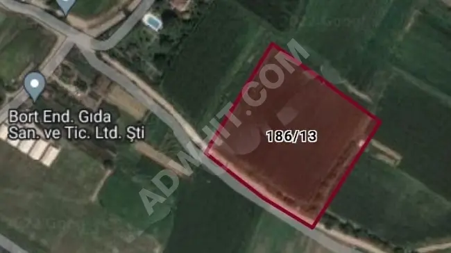 Land for sale in the village of BEYKOZ CUMHURİYET with an area of 10,370 m² and a frontage on the road