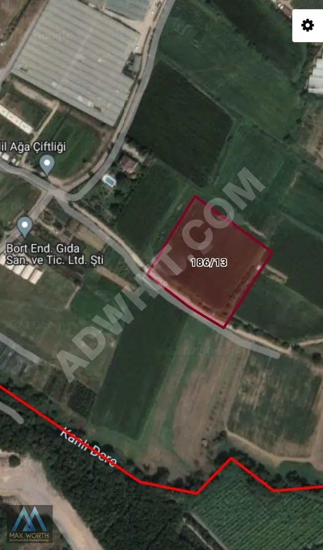 Land for sale in the village of BEYKOZ CUMHURİYET with an area of 10,370 m² and a frontage on the road