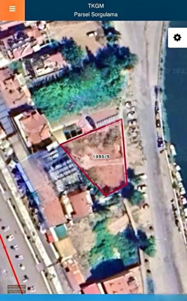 A wonderful plot of land measuring 671 square meters in Fethiye, Foça, facing the sea, the beach, and the road, with residential allocation.