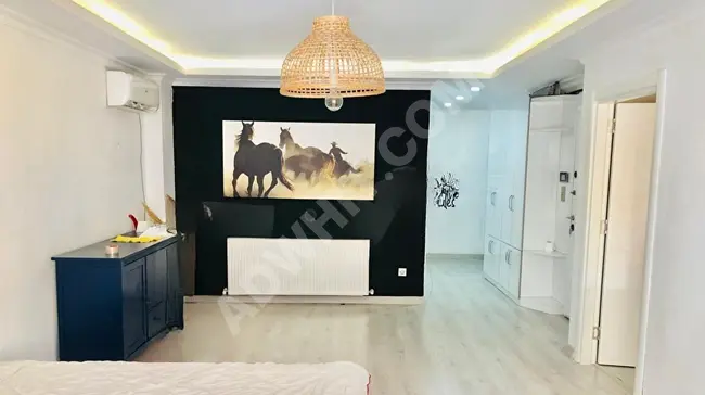 Apartment in Cihangir, 5 minutes from Taksim, in a new and modern building, with a balcony, elevator, (2) air conditioners, central heating.