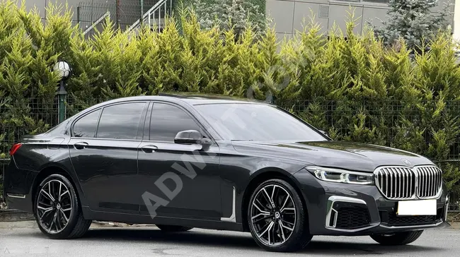 BMW 730d xDrive car with suction system and seat heating, brown interior color (TABA), and face lift modification from KARLIK AUTO.