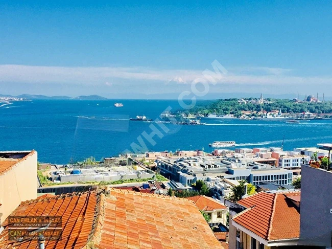 Apartment (5+1) in Cihangir with a stunning view of the sea and city, furnished with brand new modern furniture, with a balcony, meticulously renovated and maintained.