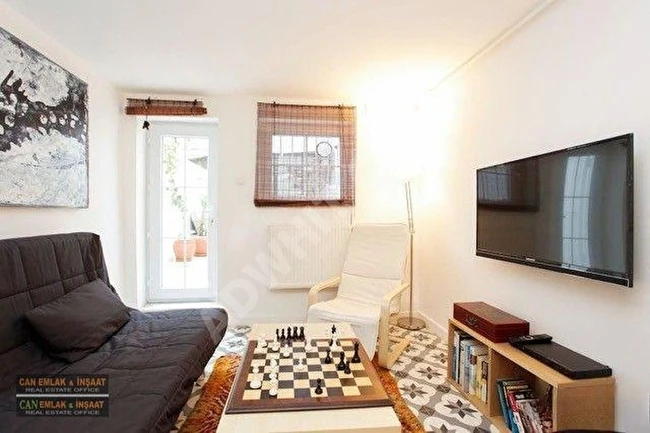 Duplex Apartment (2+1) with an area of 150m² in the heart of Cihangir, fully renovated, private garden, equipped with air conditioning and heating.