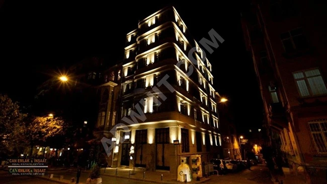 Luxury residential building (A+) with unique design, featuring two shops on the ground floor and a terrace. In the heart of Cihangir,