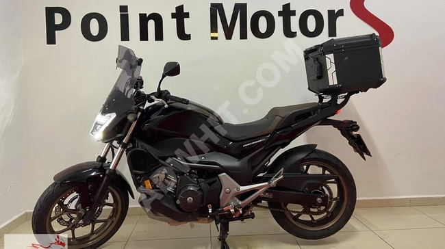 A motorcycle with installment and trade-in options available from Point Motors.