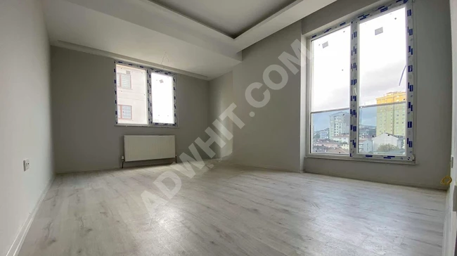 New 2+1 apartment for sale with a completely open front view, a spacious kitchen, parking, and with an İSKAN document.