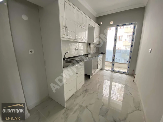 New 2+1 apartment for sale with a completely open front view, a spacious kitchen, parking, and with an İSKAN document.